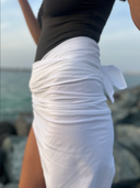 Side close-up of the lightweight, breathable 100% cotton Caletta Pareo fabric texture for high-quality resort wear.