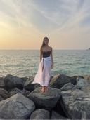 Caletta White 100% Cotton Pareo styled long as an elegant sarong skirt, demonstrating full coverage resort wear.