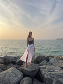 Caletta 100% Cotton Pareo styled long, flowing in the seaside breeze. Elegant full-coverage resort wear look.