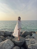 Caletta 100% Cotton Long Chemise worn semi open, flowing gently on the model by the seaside. Relaxed fit.